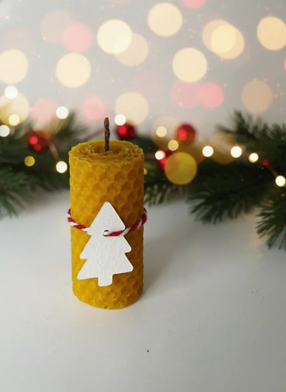 Natural colored candle with Christmas decoration